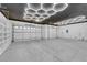 Spacious three-car garage with ample storage, modern lighting, and room for vehicles and hobbies at 4722 Blue Mesa Way, Las Vegas, NV 89129