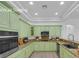 Updated kitchen features stainless steel appliances, custom cabinets, countertops, and recessed lighting at 4722 Blue Mesa Way, Las Vegas, NV 89129