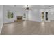 Bright and airy living room with a decorative fireplace and hardwood floors throughout at 4722 Blue Mesa Way, Las Vegas, NV 89129