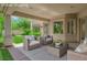 Inviting covered patio with comfortable seating, perfect for outdoor relaxation and entertaining at 4722 Blue Mesa Way, Las Vegas, NV 89129