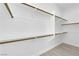 Walk-in closet with shelving and brass toned rods at 4722 Blue Mesa Way, Las Vegas, NV 89129