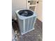 A modern central air conditioning unit is nestled outside with a fence and gate nearby at 6080 Golden Corral Trl # 103, Henderson, NV 89011