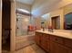 Bathroom features a glass-enclosed shower, sleek vanity, and tile flooring at 6080 Golden Corral Trl # 103, Henderson, NV 89011