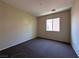 Simple bedroom with neutral paint and carpet flooring at 6080 Golden Corral Trl # 103, Henderson, NV 89011
