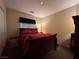 Inviting bedroom with striped bedding, plush pillows, and cozy atmosphere at 6080 Golden Corral Trl # 103, Henderson, NV 89011