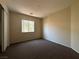 Modest bedroom with carpet and window, offering a blank canvas at 6080 Golden Corral Trl # 103, Henderson, NV 89011
