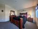 Comfortable bedroom with dark wood furniture, neutral carpet, and window at 6080 Golden Corral Trl # 103, Henderson, NV 89011
