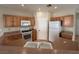 Bright kitchen with classic appliances and plenty of cabinet space at 6080 Golden Corral Trl # 103, Henderson, NV 89011