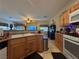 Kitchen featuring light wood cabinets, modern appliances, and an open design connecting to the living area at 6080 Golden Corral Trl # 103, Henderson, NV 89011