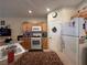 Cozy kitchen featuring ample counter space, wooden cabinets, and essential appliances, with adjacent breakfast nook at 6080 Golden Corral Trl # 103, Henderson, NV 89011