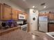 Kitchen features light wood cabinetry, modern appliances, and a convenient layout for cooking at 6080 Golden Corral Trl # 103, Henderson, NV 89011