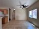 Open living area with tile flooring, a ceiling fan, and a bright window at 6080 Golden Corral Trl # 103, Henderson, NV 89011
