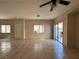 Open living area with neutral walls, tile flooring, and access to a patio at 6080 Golden Corral Trl # 103, Henderson, NV 89011
