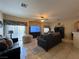Spacious living room with tile flooring, comfortable seating, and a ceiling fan for added comfort at 6080 Golden Corral Trl # 103, Henderson, NV 89011