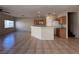 Open living space with tiled flooring, breakfast bar, and neutral decor at 6080 Golden Corral Trl # 103, Henderson, NV 89011