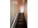 Carpeted staircase with white handrail leading to the upper level of the home at 6080 Golden Corral Trl # 103, Henderson, NV 89011