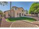 Exterior of the house with a lush green lawn at 8447 Amherst Valley St, Las Vegas, NV 89123