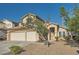 Inviting two-story home featuring well-maintained landscaping, a three-car garage, and a welcoming entrance at 8447 Amherst Valley St, Las Vegas, NV 89123