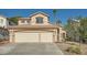 Charming two-story home with a stucco exterior, desert landscaping, and a spacious three-car garage at 8447 Amherst Valley St, Las Vegas, NV 89123