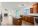 Open-concept kitchen with an island, seamless flow to the living room, and granite countertops at 8447 Amherst Valley St, Las Vegas, NV 89123