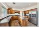 Spacious kitchen with an island, stainless steel appliances, granite countertops, and ample storage at 8447 Amherst Valley St, Las Vegas, NV 89123
