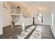 Spacious living room boasts high ceilings, tile floors, a staircase, and plenty of natural light at 8447 Amherst Valley St, Las Vegas, NV 89123