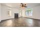 Bright living room featuring a cozy fireplace, tile flooring, and abundant natural light from large windows at 8447 Amherst Valley St, Las Vegas, NV 89123