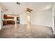 Spacious open-plan living room connecting the kitchen and featuring tiled floors and neutral walls at 8447 Amherst Valley St, Las Vegas, NV 89123
