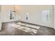 Bright, airy living room featuring large windows, tile floors, and ample natural light at 8447 Amherst Valley St, Las Vegas, NV 89123