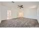 Spacious bedroom with plush carpeting, ceiling fan and access to ensuite bathroom at 8447 Amherst Valley St, Las Vegas, NV 89123