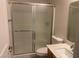 Bathroom featuring a shower with frosted glass door at 8584 Garnet Lake Ave, Las Vegas, NV 89113