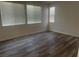 Cozy bedroom with hardwood floors and plenty of natural light from large windows at 8584 Garnet Lake Ave, Las Vegas, NV 89113
