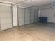 Spacious three car garage with two closed doors at 8584 Garnet Lake Ave, Las Vegas, NV 89113