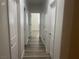 Hallway with wood-look floors leading to a bright room at 8584 Garnet Lake Ave, Las Vegas, NV 89113