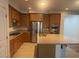 Kitchen area with granite countertop island, stainless steel appliances and hardwood floors at 8584 Garnet Lake Ave, Las Vegas, NV 89113
