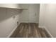 Laundry room with wood-look floors and shelf at 8584 Garnet Lake Ave, Las Vegas, NV 89113