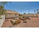Landscaped backyard featuring raised garden beds, offering an inviting outdoor space for relaxation and recreation at 100 Underhill Ct, Las Vegas, NV 89145