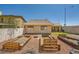 Large backyard with garden beds and outdoor living space, ideal for enjoying the outdoors at 100 Underhill Ct, Las Vegas, NV 89145