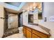 Bathroom featuring a modern vanity, mirror, shower, and toilet at 100 Underhill Ct, Las Vegas, NV 89145