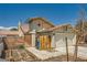Two-story home with a tile roof, an attached two-car garage, and decorative sunburst accent at 100 Underhill Ct, Las Vegas, NV 89145