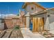 Two-story home with tile roofing, a gated front yard, and an attached two-car garage at 100 Underhill Ct, Las Vegas, NV 89145