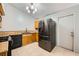 Kitchen features stainless steel appliances, tile flooring, and oak cabinetry at 100 Underhill Ct, Las Vegas, NV 89145