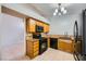 Kitchen features oak cabinets, modern appliances, tile floors, and lots of light at 100 Underhill Ct, Las Vegas, NV 89145
