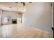 Spacious living room with tile flooring, fireplace, and access to the patio at 100 Underhill Ct, Las Vegas, NV 89145