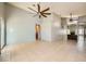 Spacious living room with tile flooring, vaulted ceilings, and a ceiling fan at 100 Underhill Ct, Las Vegas, NV 89145
