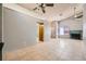 Open living room showing neutral paint, tile floors and a fireplace at 100 Underhill Ct, Las Vegas, NV 89145