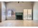 Living room features a fireplace, tile flooring, and natural light at 100 Underhill Ct, Las Vegas, NV 89145