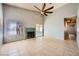 Bright living room with tile floors, a fireplace, and sliding glass doors to the patio at 100 Underhill Ct, Las Vegas, NV 89145
