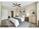 This virtually staged bedroom features a bed and an ensuite bathroom at 10550 W Alexander Rd # 2103, Las Vegas, NV 89129