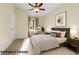 This virtually staged bedroom features a bed, desk, and neutral decor at 10550 W Alexander Rd # 2103, Las Vegas, NV 89129